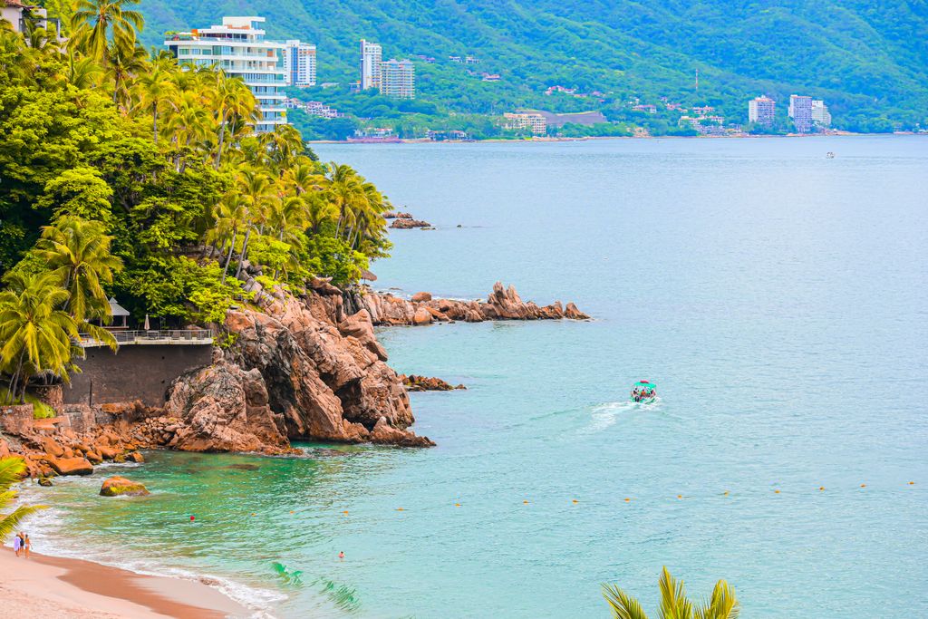 Beautiful coastal view of Puerto Vallarta with lush greenery and clear waters.
